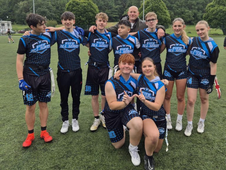 Fife All Stars players, in a posed picture, celebrating winning BAFA U17 League.